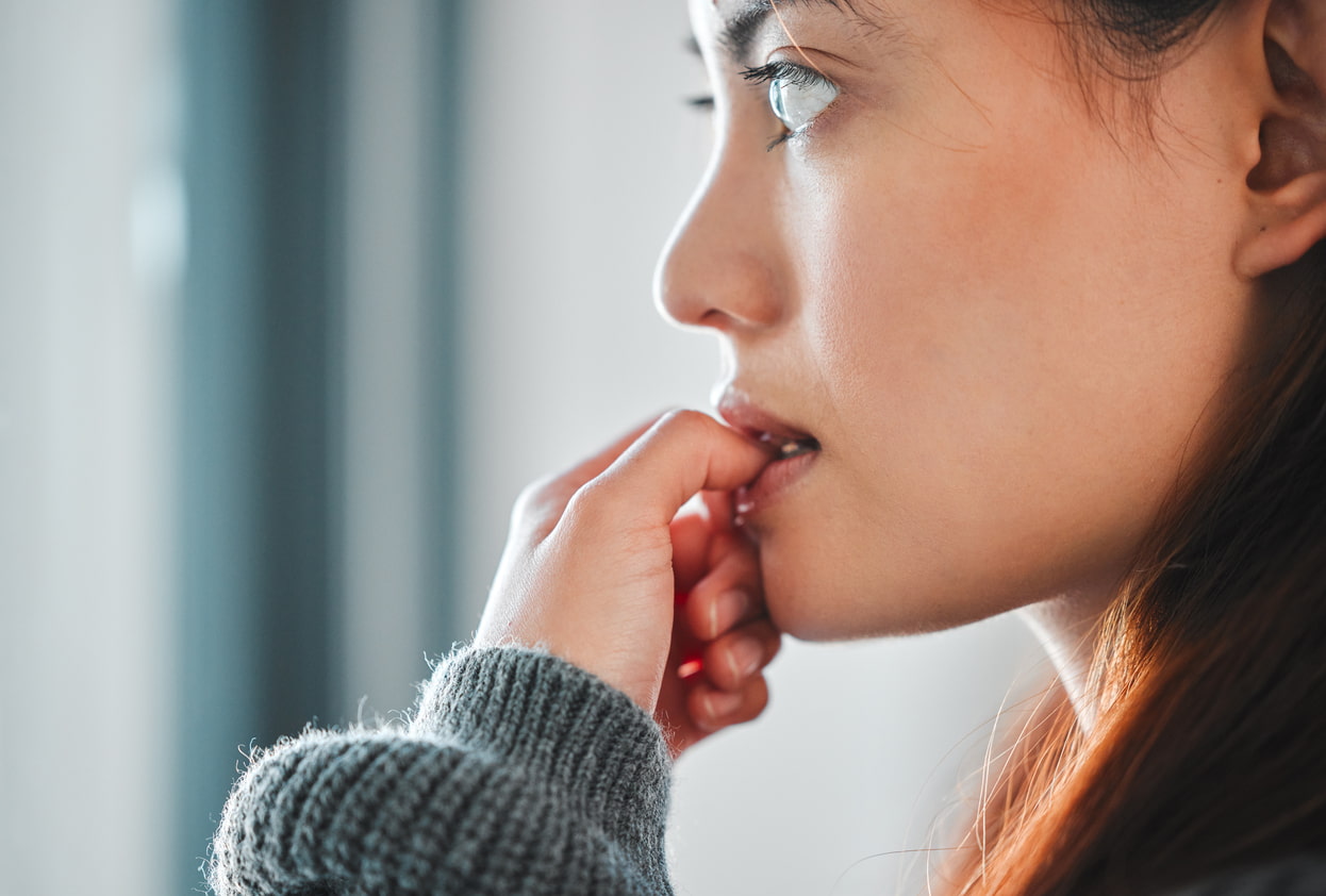 woman biting her nails