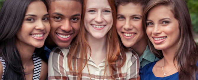 a group of smiling teenagers